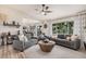 Bright living room showcasing hardwood floors, an open floor plan, and large windows at 9265 E Kalil Dr, Scottsdale, AZ 85260
