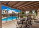 Inviting covered patio overlooking the pool and landscaped backyard at 9265 E Kalil Dr, Scottsdale, AZ 85260