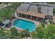 Aerial view of a home showcasing a beautiful in-ground swimming pool and covered patio at 9476 E Laurel Ln, Scottsdale, AZ 85260