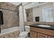 Bathroom featuring a bath tub and a vanity with a black countertop at 9476 E Laurel Ln, Scottsdale, AZ 85260