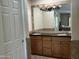 Bathroom featuring a double sink vanity with stone countertops and a large mirror at 9476 E Laurel Ln, Scottsdale, AZ 85260