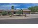 Charming single-story home with a two-car garage and low-maintenance desert landscaping at 9476 E Laurel Ln, Scottsdale, AZ 85260