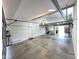 Spacious garage featuring high ceilings, ample lighting, and utility area at 9476 E Laurel Ln, Scottsdale, AZ 85260