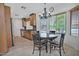Bright eat-in kitchen featuring lots of counter space, warm wood cabinets, and stainless appliances at 9476 E Laurel Ln, Scottsdale, AZ 85260