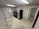 Large laundry room with stainless steel refrigerator and washer and dryer at 9476 E Laurel Ln, Scottsdale, AZ 85260