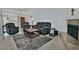 Bright living room with fireplace, entry table, and views of dining area at 9476 E Laurel Ln, Scottsdale, AZ 85260
