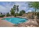 Inviting backyard swimming pool area with lush landscaping and outdoor seating at 9476 E Laurel Ln, Scottsdale, AZ 85260