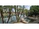 Inviting backyard featuring a spa with waterfront views and palm trees offering a tranquil outdoor retreat at 10175 E Cochise Dr, Scottsdale, AZ 85258