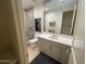 Well-lit bathroom with a modern vanity, walk-in shower, and neutral color palette at 10175 E Cochise Dr, Scottsdale, AZ 85258