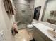 Modern bathroom with glass shower, stylish vanity, and neutral color scheme at 10175 E Cochise Dr, Scottsdale, AZ 85258