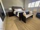 Bedroom with a king-sized bed, sitting area, and a light filtering window at 10175 E Cochise Dr, Scottsdale, AZ 85258