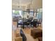 Open floor plan with living area, dining room, and backyard view at 10175 E Cochise Dr, Scottsdale, AZ 85258