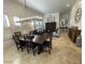 Traditional dining room with a wooden table, chandelier, and window shutters at 10175 E Cochise Dr, Scottsdale, AZ 85258