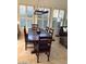 Charming dining room with a wooden table and seating, bathed in natural light at 10175 E Cochise Dr, Scottsdale, AZ 85258