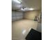 Spacious two car garage with a clean epoxy floor, fluorescent lights, and plenty of room at 10175 E Cochise Dr, Scottsdale, AZ 85258