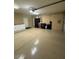 Clean garage with epoxy flooring, storage cabinets, and ample space for vehicles and more at 10175 E Cochise Dr, Scottsdale, AZ 85258