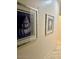Hallway with beach-themed artwork at 10175 E Cochise Dr, Scottsdale, AZ 85258