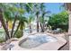 Inviting backyard with a private hot tub, waterside views and a lounge chair at 10175 E Cochise Dr, Scottsdale, AZ 85258