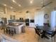 Bright kitchen with a waterfall island, stainless steel appliances, and an adjacent dining area at 10175 E Cochise Dr, Scottsdale, AZ 85258