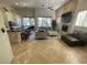 Spacious living room featuring fireplace, tile flooring, and comfortable seating arrangement at 10175 E Cochise Dr, Scottsdale, AZ 85258