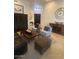 Inviting living room with stylish seating, a coffee table, and tasteful décor accents at 10175 E Cochise Dr, Scottsdale, AZ 85258
