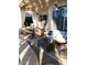 Outdoor patio space with ceiling fans, dining table, outdoor seating and a nearby pool at 10175 E Cochise Dr, Scottsdale, AZ 85258