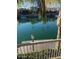 Waterfront view from the outdoor patio with a dock and boats passing by at 10175 E Cochise Dr, Scottsdale, AZ 85258