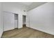 Bright bedroom showcasing wood floors, closet with sliding doors, and neutral walls at 1441 W Sea Haze Dr, Gilbert, AZ 85233