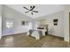 Cozy bedroom featuring a ceiling fan, area rug, and access to an outdoor space at 1441 W Sea Haze Dr, Gilbert, AZ 85233