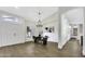 Bright dining room with wood floors, contemporary light fixture, and an open layout at 1441 W Sea Haze Dr, Gilbert, AZ 85233