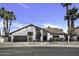 Charming single-story home with a tile roof, manicured landscaping, and a two-car garage at 1441 W Sea Haze Dr, Gilbert, AZ 85233