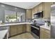 Updated kitchen featuring stainless appliances, light countertops, and lots of natural light at 1441 W Sea Haze Dr, Gilbert, AZ 85233