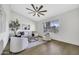 Cozy living room with lots of natural light, wood floors, and comfortable seating at 1441 W Sea Haze Dr, Gilbert, AZ 85233