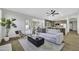 Open-concept living room seamlessly connects to a modern kitchen and breakfast nook, ideal for entertaining at 1441 W Sea Haze Dr, Gilbert, AZ 85233