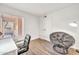 This bedroom features wood floors, a gray chair and an exterior window for natural light at 14801 N 25Th Dr # 2, Phoenix, AZ 85023