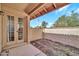 View of patio with beige brick, wooden roof, door and blue sky at 14801 N 25Th Dr # 2, Phoenix, AZ 85023