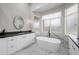 Bathroom offers a soaking tub, dual vanity, and modern fixtures at 15064 N 54Th Way, Scottsdale, AZ 85254