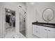 Modern bathroom featuring marble floors, glass-enclosed shower, and stylish white vanity at 15064 N 54Th Way, Scottsdale, AZ 85254