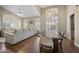 Spacious dining area complemented by elegant chandelier and abundant natural light from large windows at 15064 N 54Th Way, Scottsdale, AZ 85254