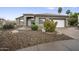 Charming single-story home featuring a neutral color palette, low-maintenance landscaping, and a two-car garage at 15064 N 54Th Way, Scottsdale, AZ 85254