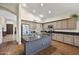 Bright kitchen features granite counters, island, and stainless steel appliances at 15064 N 54Th Way, Scottsdale, AZ 85254