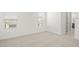 Bedroom with carpet, neutral walls, and natural light from two windows at 17854 W Mission Ln, Waddell, AZ 85355