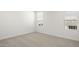 Bedroom with carpet, neutral walls, and natural light from two windows at 17854 W Mission Ln, Waddell, AZ 85355