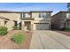 Inviting two-story home with a two-car garage, stone accents, and a well-maintained front yard at 1821 E Patrick Ln, Phoenix, AZ 85024