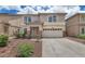 Charming home featuring a two-car garage and desert landscaping for low maintenance living at 1821 E Patrick Ln, Phoenix, AZ 85024