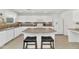 Bright kitchen featuring white cabinets and countertops, an island, and modern appliances for a great cooking experience at 1821 E Patrick Ln, Phoenix, AZ 85024