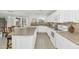 Bright kitchen with a center island, stylish countertops, and a view of the backyard, perfect for modern living at 1821 E Patrick Ln, Phoenix, AZ 85024