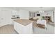 Bright kitchen with a center island, flowing into a living area, and a breakfast nook; perfect for everyday living at 1821 E Patrick Ln, Phoenix, AZ 85024