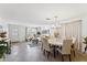 Open-concept living and dining area with tile floors and natural light from large windows at 1821 E Patrick Ln, Phoenix, AZ 85024