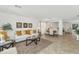 Bright living room and dining area featuring neutral tones and tile flooring throughout at 1821 E Patrick Ln, Phoenix, AZ 85024